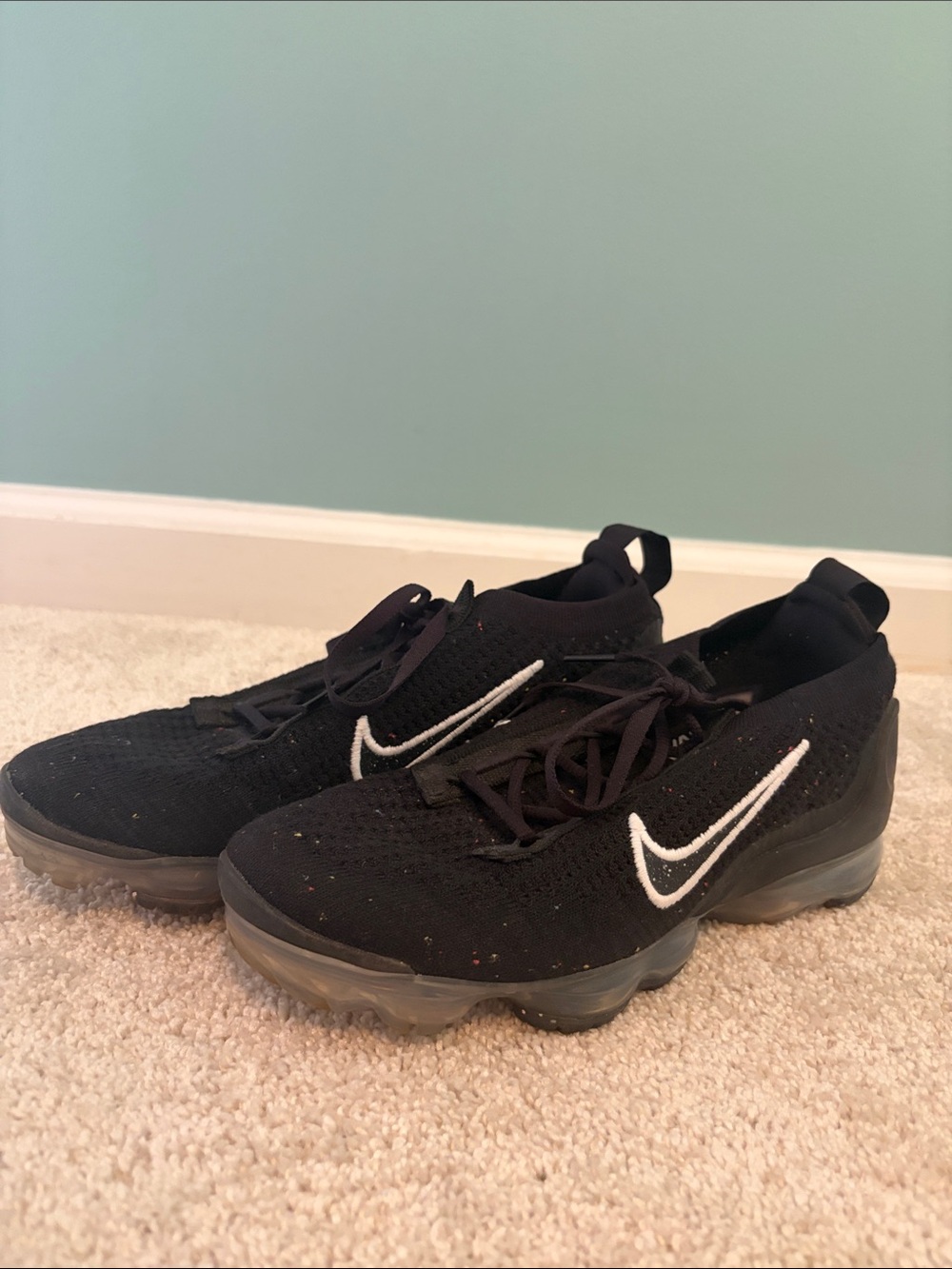 Nike Black Flyknit Sneakers with White Swoosh